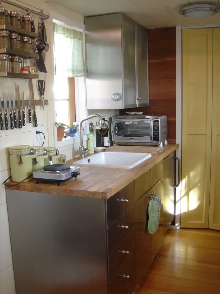 Large sink, nice countertop and stainless steel cabinetry, including refrigerator