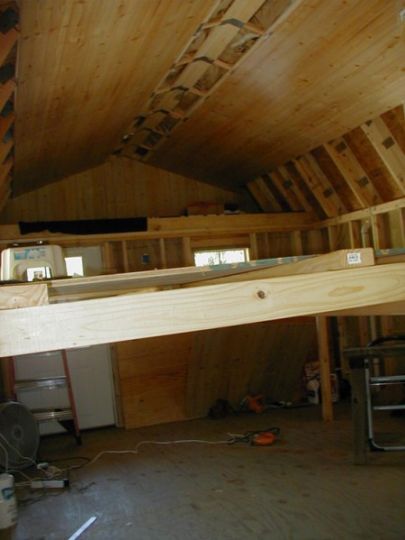 A temporary scaffolding was used to give workers the ability to reach high enough to do their insulation and paneling work on the ceiling.
