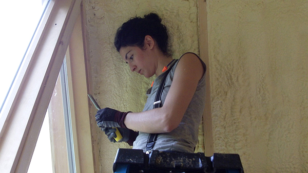 Angelica working with insulating the windows