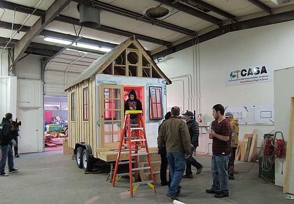 advanced construction students and tiny house