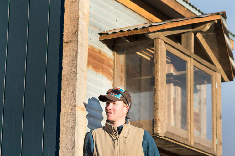 Spice Box Homes owner and simple living expert Chris Curry in front of his latest build.