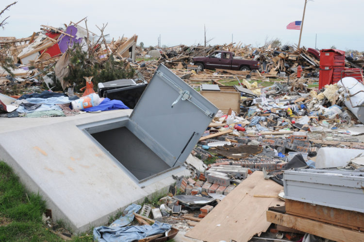 Moore, OK, June 8, 2013 -- This new style storm shelter survived the May 20 EF5 tornado while most houses in the neighborhood did not. Many safety officials and FEMA Hazard Mitigation suggest the best place to be in this type of storm is underground. George Armstrong/FEMA