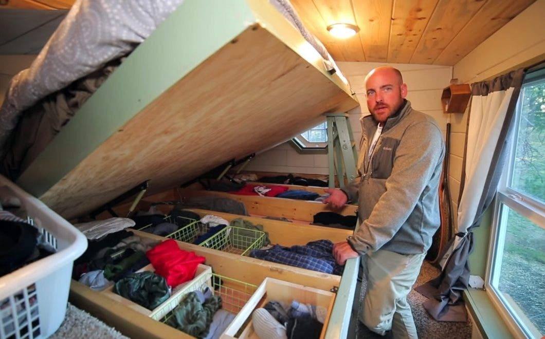 https://150057231.v2.pressablecdn.com/wp-content/uploads/2021/04/tiny-house-under-the-bed-clothing-storage-scaled-e1599673525502-2048x1275-1.jpeg