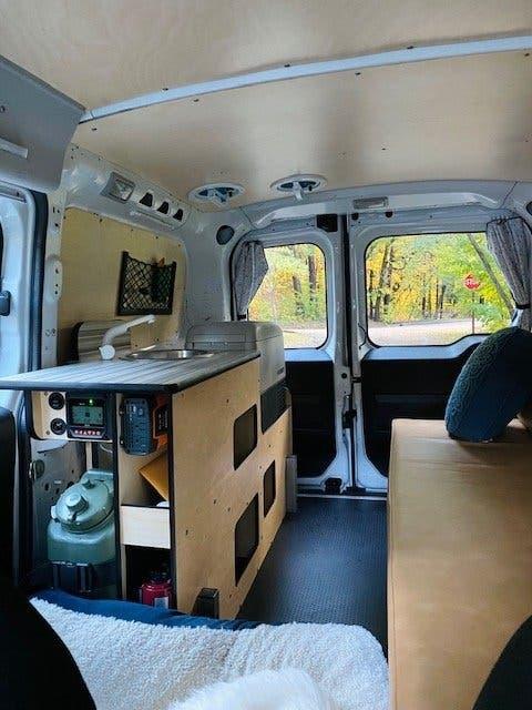 kitchen and bed in van