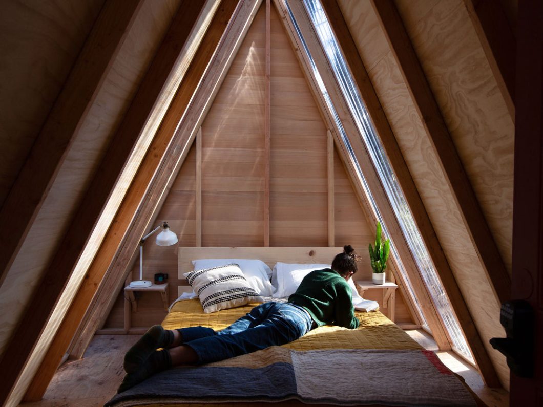 person on a-frame bed