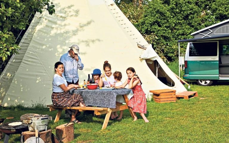 Family in front of Glamping Tipi